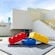 The modern Lego House with a large Lego brick sculpture in the front plaza